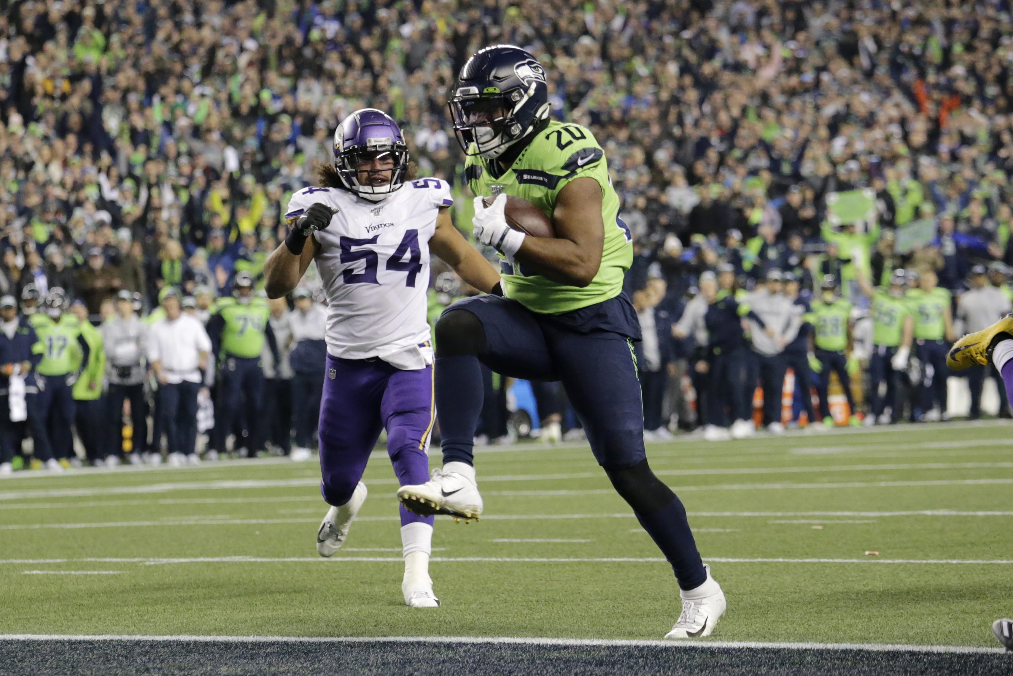 Seattle Seahawks' Rashaad Penny high steps into the end zone for a touchdown against the Minnesota Vikings during the second half of an NFL football game, Monday, Dec. 2, 2019, in Seattle.