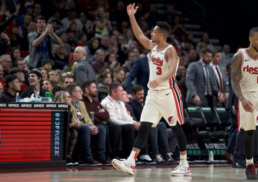 Portland Trail Blazers guard CJ McCollum hypes up the crowd after scoring against Golden State during the second half Wednesday in Portland. The Blazers won 122-112.