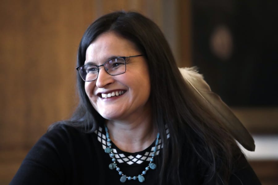 Whatcom County Superior Court Judge Raquel Montoya-Lewis, wearing an eagle feather honoring her Native American heritage, smiles as she speaks with media members after being named to the state Supreme Court Wednesday, Dec. 4, 2019, in Olympia, Wash. Montoya-Lewis was appointed to the bench by Washington Gov. Jay Inslee, who said she will be the first Native American justice to serve on the state&#039;s highest court. Montoya-Lewis, an enrolled member of the Pueblo of Isleta and a descendant of the Pueblo of Laguna Indian tribes, will be sworn in next month to fulfill the remaining year of Chief Justice Mary Fairhurst&#039;s term, and the seat will be open for election in 2020.