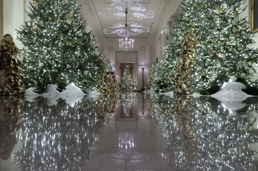 The Cross Hall leading into the State Dinning Room is decorated Monday during the 2019 Christmas preview at the White House in Washington.