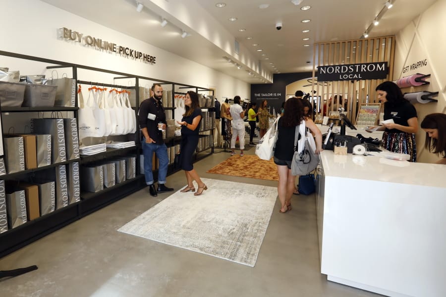 People visit the Nordstrom Local store Sept. 5, 2019, on New York&#039;s Upper East Side. The new store carries no merchandise and instead offers tailoring services and allows customers to pick up or return online orders.