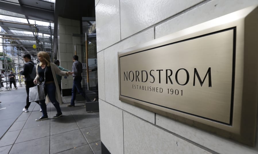 In this Wednesday, Sept. 13, 2017, photo, shoppers come and go from Nordstrom Inc.&#039;s flagship store in downtown Seattle. Nordstrom, Inc. reports earnings Thursday, Nov. 9, 2017. (AP Photo/Ted S.