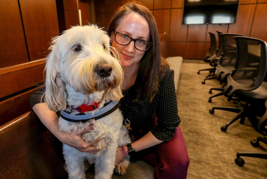 Izzy with Amy Mitchell, a casework supervisor and Izzy&#039;s handler at the Macomb County Juvenile Court in downtown Mt. Clemens on Thursday, Dec. 29, 2019.