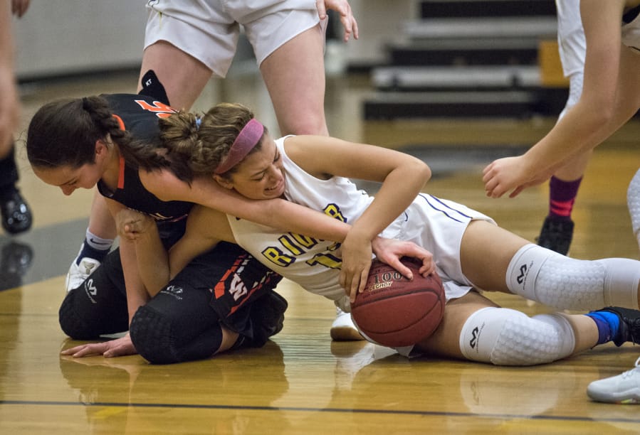 Skylar Bea, left, and her Washougal teammates always seem to get a hand on the ball. The Panthers&#039; disruptive defense has been a key to the team&#039;s success this season.