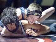 Union&#039;s Ricky Pierce (106) won by first-round pin over Camas&#039; Chase Reid in a 4A Greater St. Helens League dual on Wednesday in Camas. The Titans won 54-19.