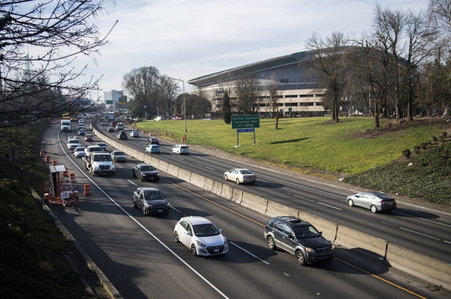 Morning traffic moves along Interstate 5 near the Moda Center in Portland, a congested section of the freeway with only two through freeway lanes that experiences 3.5 times more crashes than Oregon&#039;s statewide average.