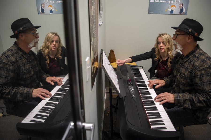 Tommy Neal, 72, takes a piano lesson with Rachel Risor at Music World in Hazel Dell. “This is the best thing I’ve ever done — not just playing randomly but learning each time,” he said.