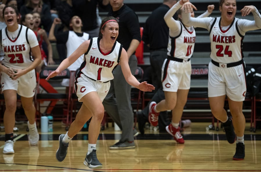 Camas&#039; Haylie Johnson (1) and her teammates celebrate their win after Tuesday night&#039;s game against Union at Camas High School.