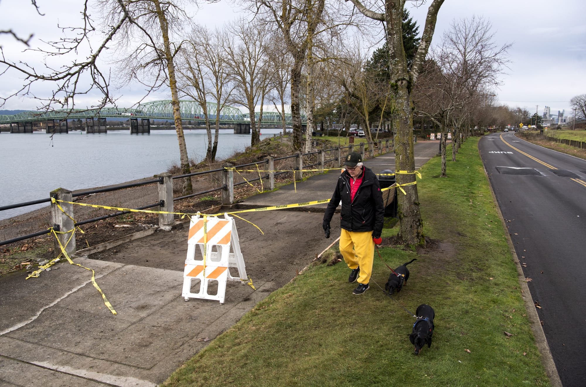 Sandy Robinson of Vancouver walks along the Waterfront Renaissance Trail with her miniature dachshunds in Vancouver on Jan. 8, 2020. Robinson said she walks the trail about once a week and the construction hasn't bothered her. "It needed it," she said.