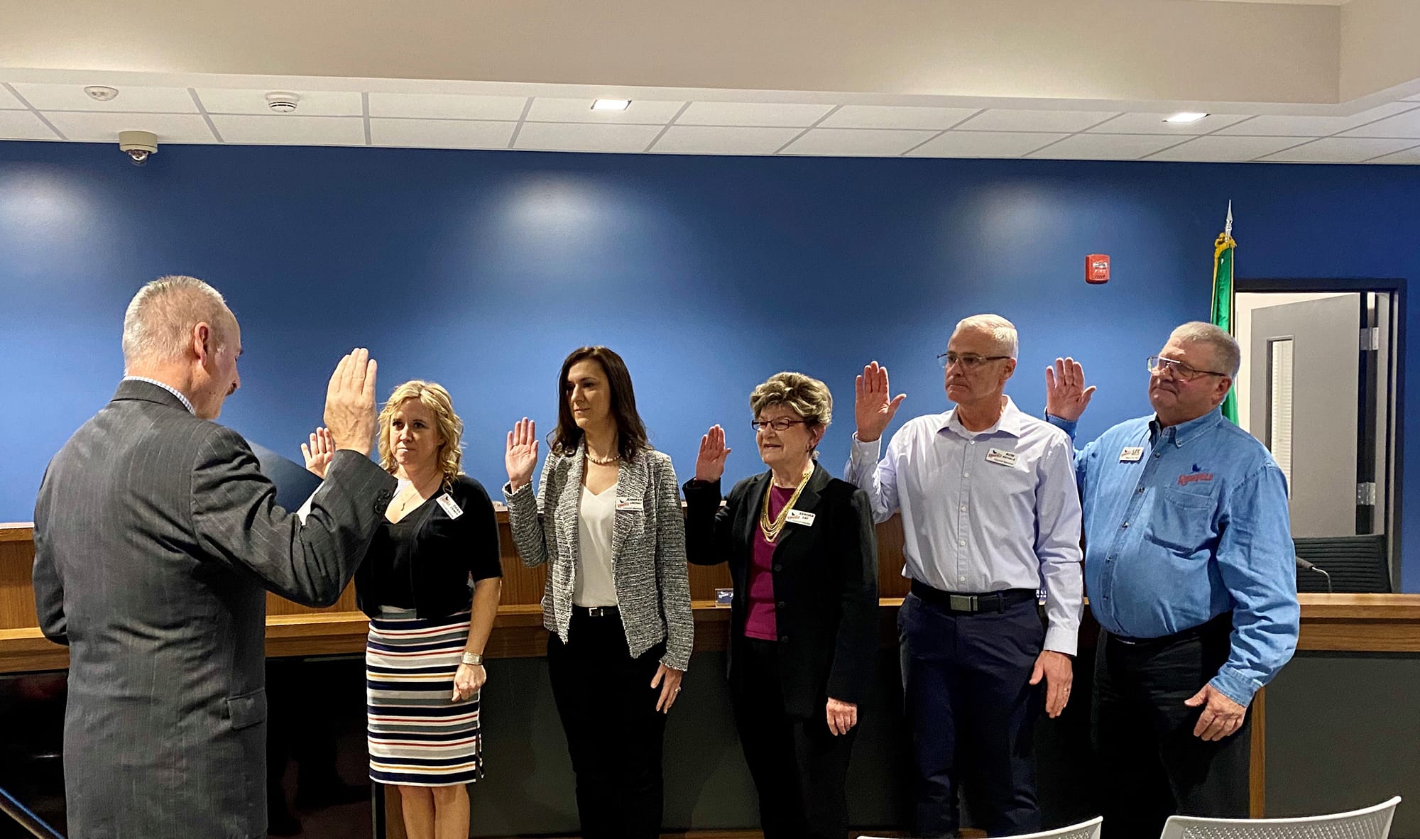 Clark County District Court Judge Darvin Zimmerman, left, swears in members of the new Ridgefield City Council at the Jan. 9 meeting: Dana Ziemer, from left, Jennifer Lindsay, Sandra Day, Rob Aichele and Lee Wells.