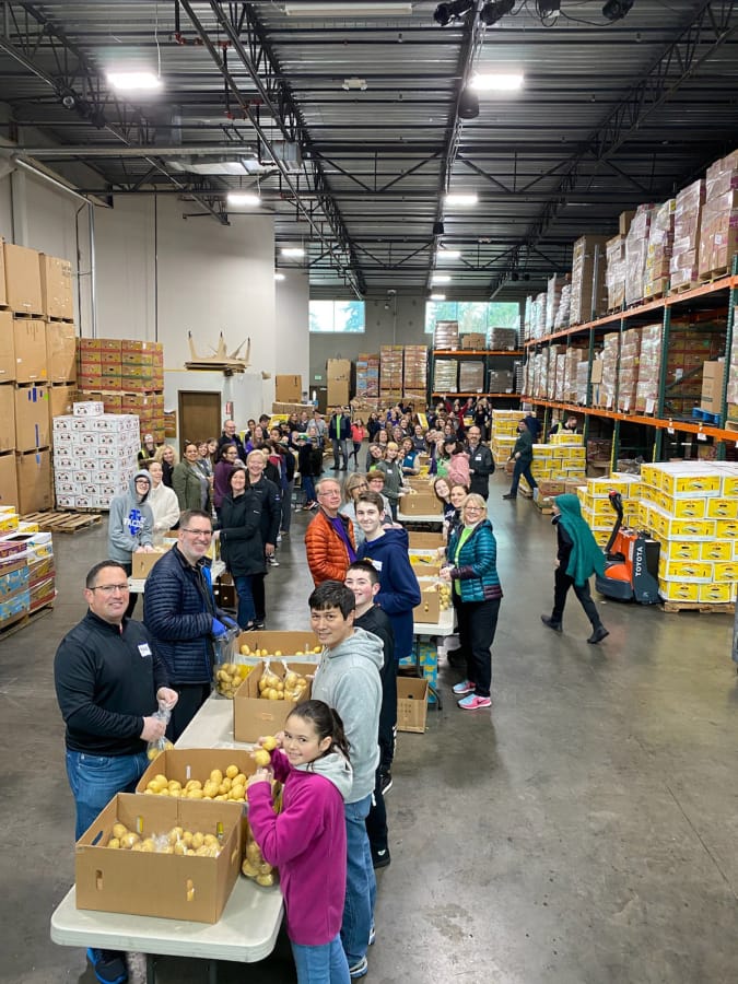 MINNEHAHA: More than 100 Kaiser Permanente employees from Southwest Washington and Oregon volunteered with their families and friends to sort 40,000 pounds of potatoes at the Clark County Food Bank on Martin Luther King Jr.