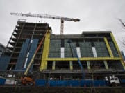 Construction of the exterior cladding of the Hotel Indigo and Kirkland Tower building is underway. The building structure is supported by its own internal skeleton, allowing for extensive use of glass in the outer walls.