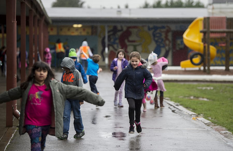Students return to their classrooms at the conclusion of recess at Union Ridge Elementary School.