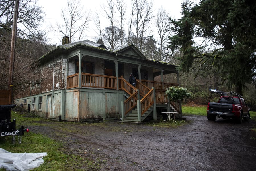 Community Roots Collaborative, a local nonprofit seeking to alleviate homelessness, works on renovations to the old Fruit Valley railway switch house in Vancouver on Monday. The building will house four tenants for $450 a month starting in March.