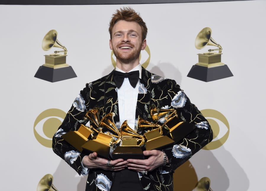 Finneas O&#039;Connell poses in the press room with the awards for best song and best record for &quot;Bad Guy,&quot; album of the year and best engineered album, non-classical for &quot;When We All Fall Asleep, Where Do We Go?,&quot; and Producer of the Year, Non Classical at the 62nd annual Grammy Awards at the Staples Center on Sunday, Jan. 26, 2020, in Los Angeles.