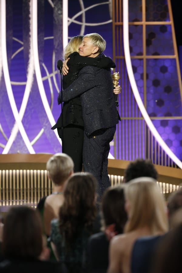 Presenter Kate McKinnon, left, embraces Ellen DeGeneres on Sunday as she accepts the Carol Burnett TV Achievement Award at the 77th Annual Golden Globe Awards in Beverly Hills, Calif.