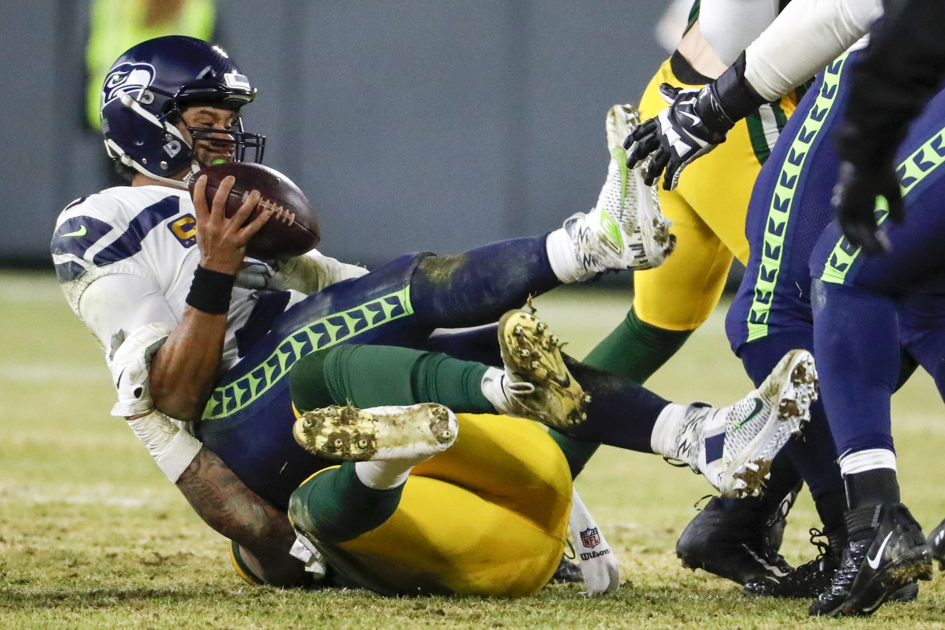 Green Bay Packers' Preston Smith sacks Seattle Seahawks' Russell Wilson during the second half of an NFL divisional playoff football game Sunday, Jan. 12, 2020, in Green Bay, Wis.