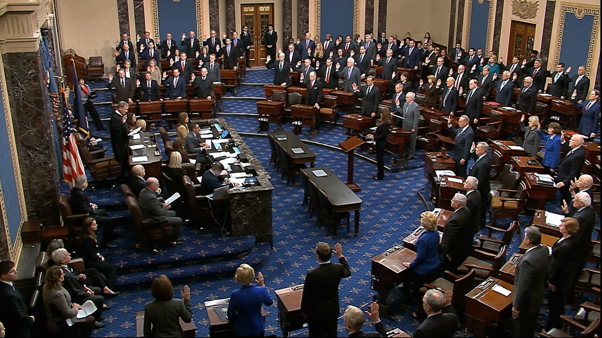 In this image from video, presiding officer Supreme Court Chief Justice John Roberts swears in members of the Senate for the impeachment trial against President Donald Trump at the U.S. Capitol in Washington, Thursday, Jan. 16, 2020.