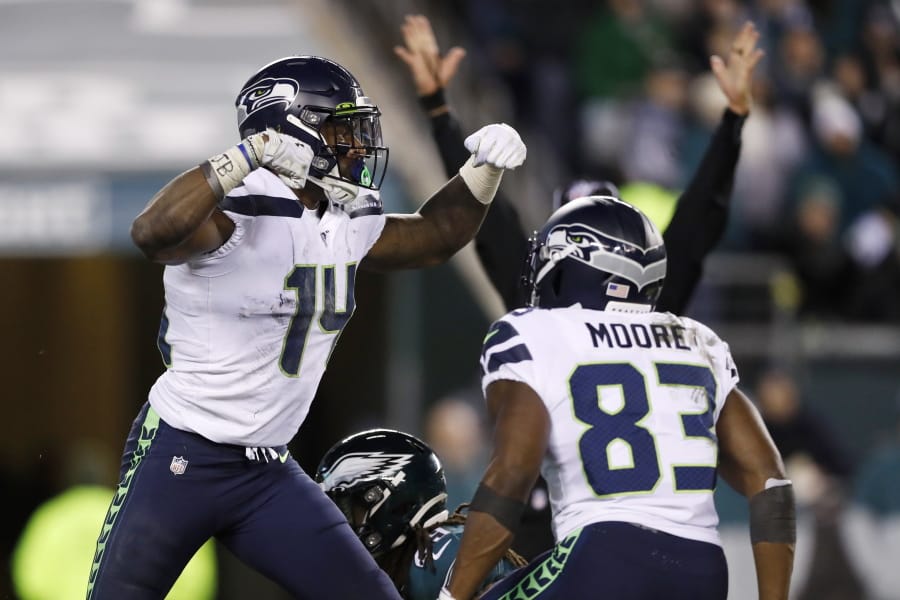 Seattle Seahawks&#039; D.K. Metcalf, left, and David Moore celebrate after Metcalf&#039;s touchdown catch during the second half of an NFL wild-card playoff football game against the Philadelphia Eagles, Sunday, Jan. 5, 2020, in Philadelphia.