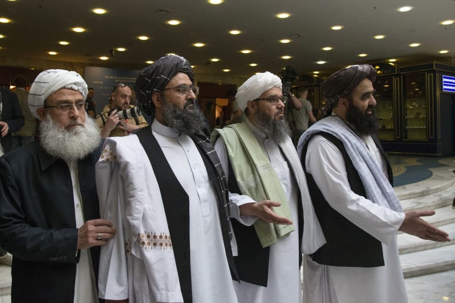 FILE - In this May 28, 2019, file photo, Mullah Abdul Ghani Baradar, the Taliban group&#039;s top political leader, second left, arrives with other members of the Taliban delegation for talks in Moscow, Russia. U.S. peace envoy Zalmay Khalilzad held on Saturday, Dec. 7, 2019 the first official talks with Afghanistan&#039;s Taliban since last September when President Donald Trump declared a near-certain peace deal with the insurgents dead.