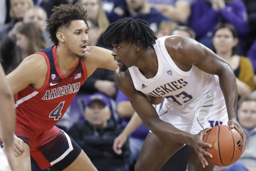 Arizona center Chase Jeter (4) pressures Washington forward Isaiah Stewart (33) during the first half of an NCAA college basketball game Thursday, Jan. 30, 2020, in Seattle. (AP Photo/Ted S.