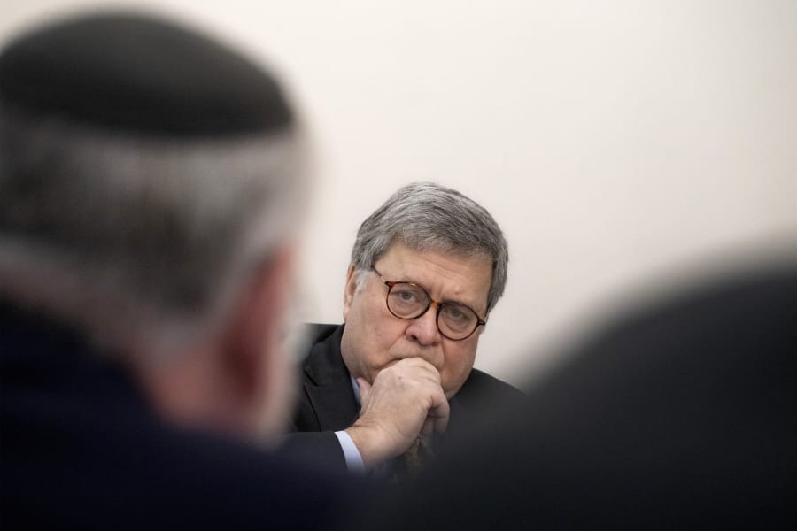 U.S. Attorney General William Barr listens during a meeting with Jewish leaders at the Boro Park Jewish Community Council, Tuesday, Jan. 28, 2020 in New York. Barr ordered federal prosecutors across the U.S. on Tuesday to step up their efforts to combat anti-Semitic hate crimes as he announced charges against a suspect who had slapped three Jewish women but was repeatedly released from jail under New York&#039;s bail reform laws.