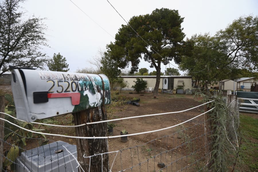 A Phoenix woman has been arrested on suspicion of killing her three children after they were found dead inside the family home at this location Tuesday, Jan. 21, 2020, in Phoenix. (AP Photo/Ross D.