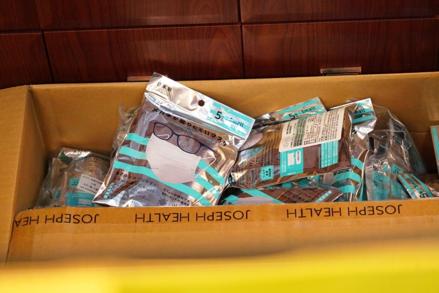 A box of masks imported from Japan sits inside a Yifeng Pharmacy in Wuhan, China, Wednesday, Jan. 22, 2020. Pharmacies in Wuhan are restricting customers to buying one mask at a time amid high demand and worries over an outbreak of a new coronavirus. The number of cases of the new virus has risen to over 400 in China and the death toll to 9, Chinese health authorities said Wednesday.