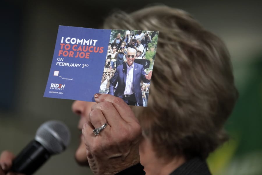 Former First Lady of Iowa Christie Vilsack holds up a card encouraging people to caucus for Democratic presidential candidate former Vice President Joe Biden during an event at the Western Iowa Tech Community College Rocklin Conference Center in Sioux City, Iowa, Wednesday, Jan. 29, 2020. (AP Photo/Gene J.