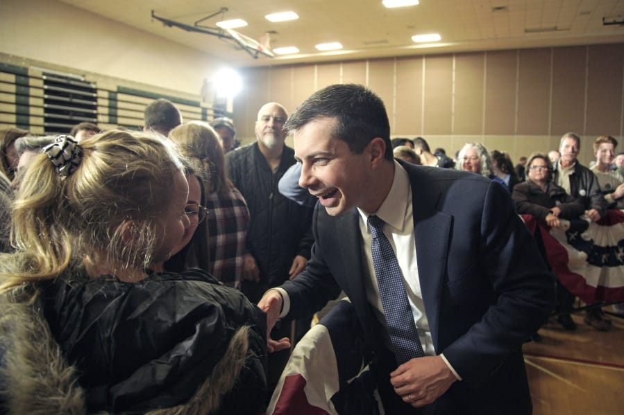 Democratic presidential candidate and former South Bend Mayor Pete Buttigieg meets with members of the audience following an election rally in Sioux City, Iowa, Thursday, Jan. 16, 2020.
