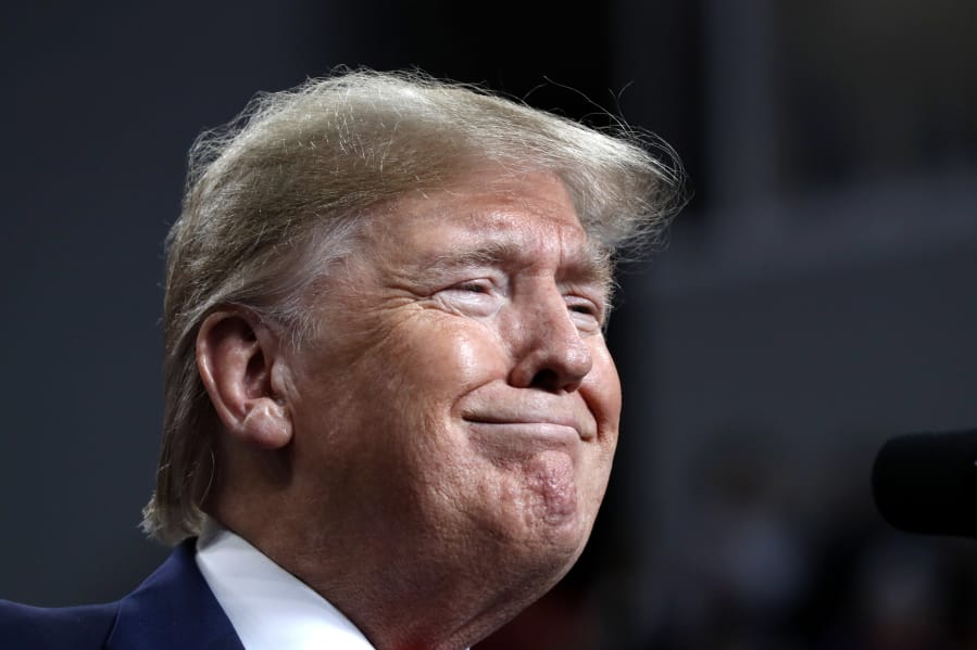 FILE - in this Jan. 9, 2020, file photo, President Donald Trump smiles while speaking at a campaign rally, in Toledo, Ohio. Trump heads to battleground Wisconsin for a rally that coincides with a Democratic presidential debate in neighboring Iowa and kicks off a year where Wisconsin will be at heart of the fight for the White House.