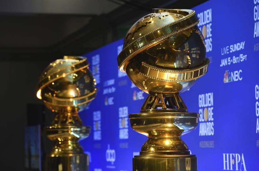 FILE - This Dec. 9, 2019 file photo shows replicas of Golden Globe statues at the nominations for the 77th annual Golden Globe Awards  in Beverly Hills, Calif. The 77th annual Golden Globe Awards will be held on Sunday, Jan. 5.