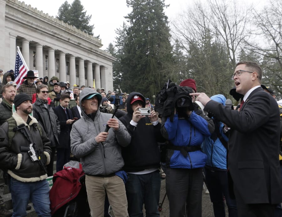Republican Rep. Matt Shea speaks at a gun-rights rally, where many gathered in support of the embattled lawmaker, Friday, Jan. 17, 2020, in Olympia, Wash. Shea was suspended from the Republican caucus in the wake of a December report that found he was involved in anti-government activities and several lawmakers have called on him to resign, something he says he will not do.