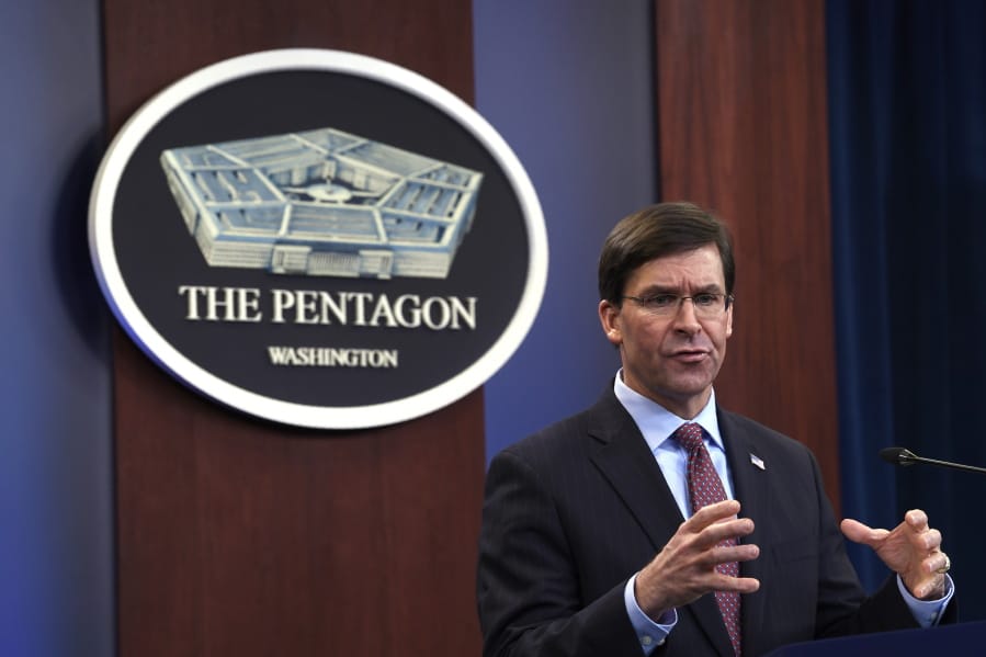 FILE - In this Dec. 20, 2019 file photo, Defense Secretary Mark Esper speaks during a news conference at the Pentagon in Washington. After the Pensacola shooting, Defense Secretary Mark Esper ordered a review of the Pentagon&#039;s handling of foreign military trainees. The results, announced Friday, put foreign trainees under new limitations, including their travel away from their assigned base; their possession and use of firearms and their access to bases and other U.S. facilities.