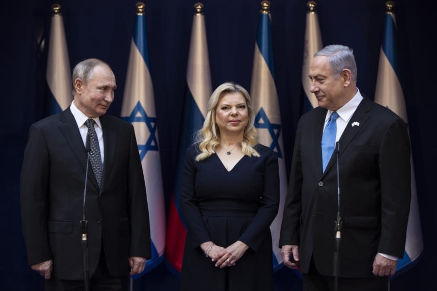 Israeli Prime Minister Benjamin Netanyahu and his wife Sarah stand with President Vladimir Putin at Netanyahu official residence in Jerusalem on January 23,2020 . Putin, will be a guest of honor Thursday at a ceremony at the Yad Vashem Holocaust Museum marking the 75th anniversary of the Soviet Red Army&#039;s liberation of the Nazi Auschwitz death camp. Presidents , prime ministers and royalty from around the world who arrived in Israel for the two-day World Holocaust Forum in Jerusalem, marking the 75th anniversary of the liberation of the Auschwitz-Birkenau concentration camp.