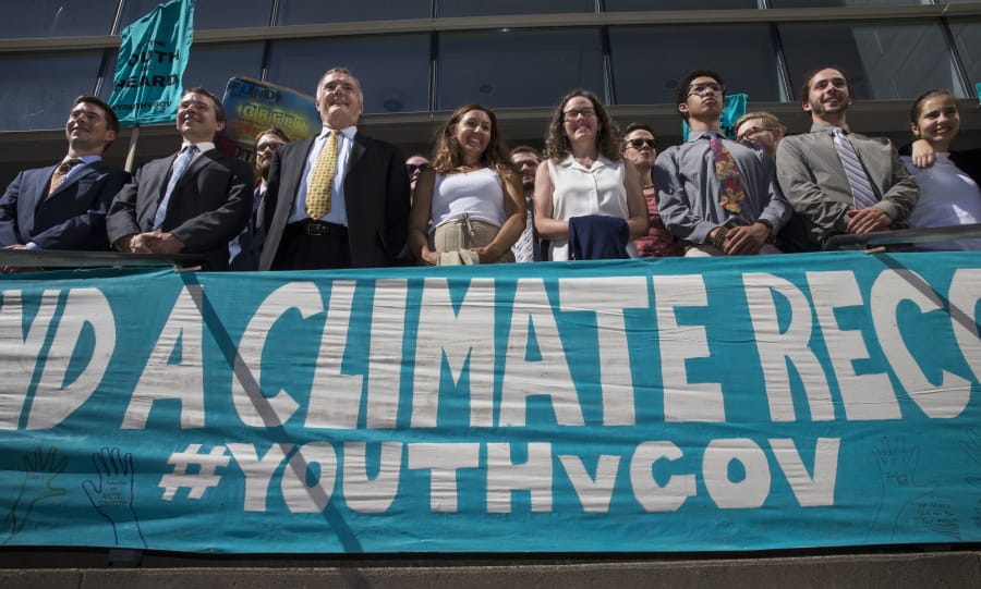 Lawyers and youth plaintiffs lineup behind a banner July 18, 2018, after a hearing before Federal District Court Judge Ann Aiken between lawyers for the Trump Administration and the so called Climate Kids in Federal Court in Eugene, Ore. A federal appeals court on Friday dismissed a lawsuit by 21 young people who claimed the U.S. government&#039;s climate policy harms them and jeopardizes their future.