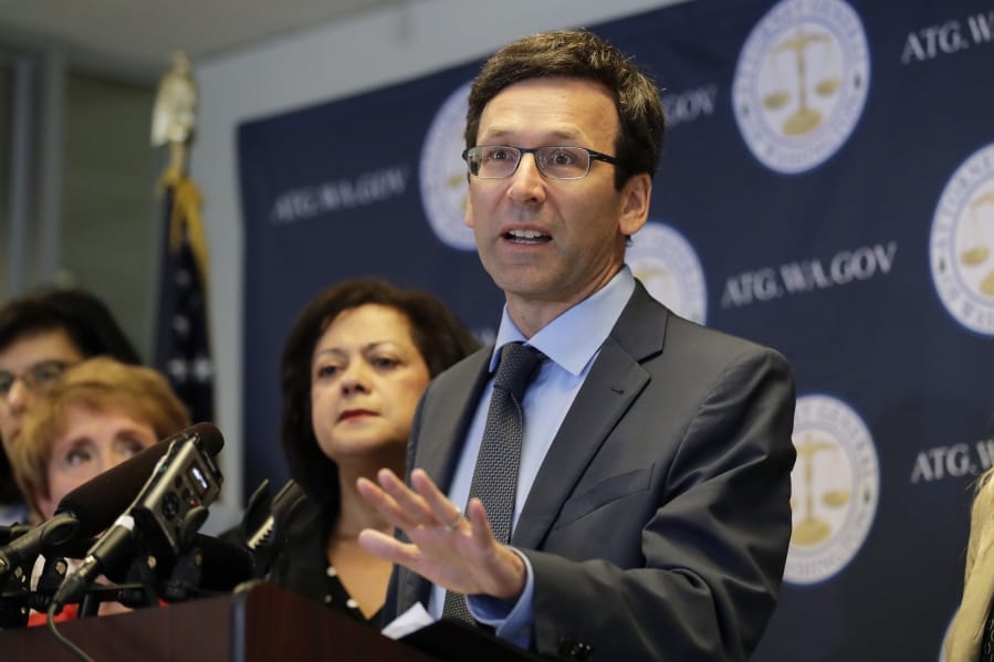 FILE - In this Aug. 26, 2019, file photo, Washington Attorney General Bob Ferguson speaks at a news conference in Seattle. Washington state sued Johnson &amp; Johnson on Thursday, Jan. 2, 2020, claiming the company was negligent when it used deceptive marketing to say the drugs were effective for treating pain and were unlikely to cause addiction. The lawsuit filed Thursday says the company that supplies raw materials used to make opiates drove the pharmaceutical industry to recklessly expand the production of the drugs. (AP Photo/Ted S.