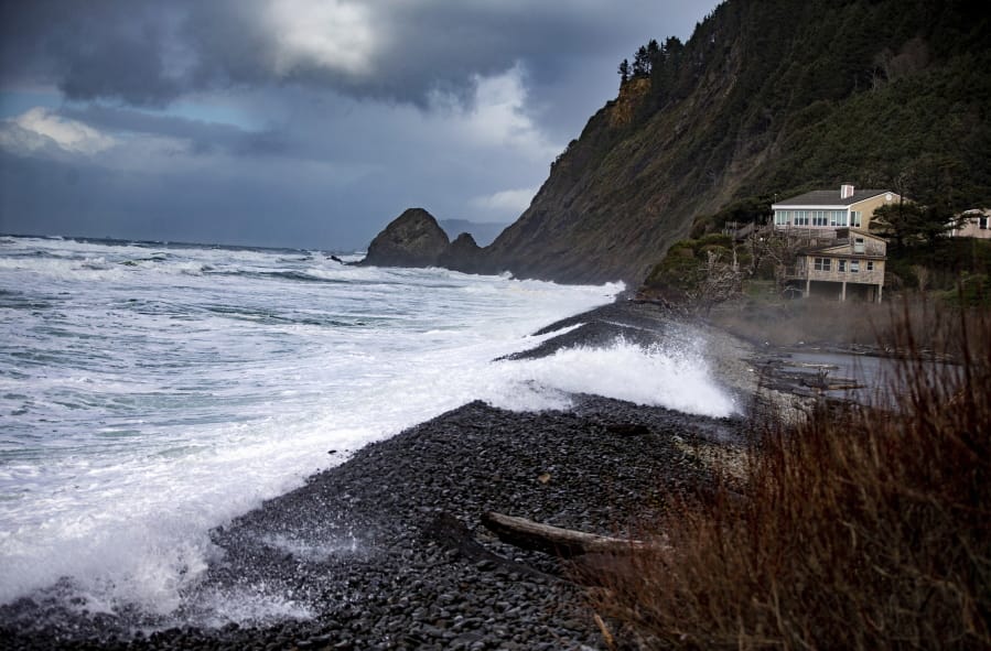 Waves crash along the shore of Falcon Cove Beach Sunday between the unincorporated community of Arch Cape to the north and Oswald West State Park to the south in Clatsop County, Ore.