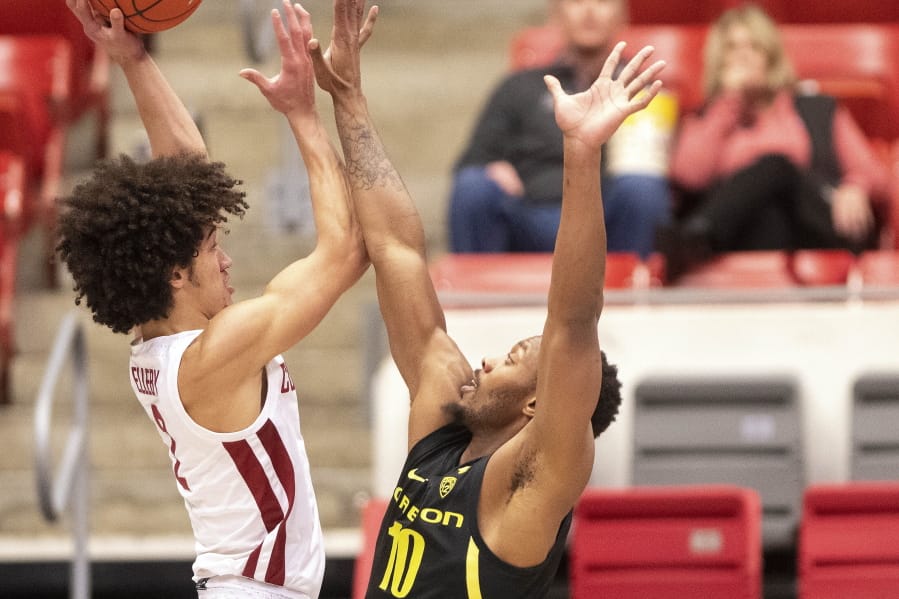 Washington State forward CJ Elleby (2) attempts a shot as Oregon forward Shakur Juiston (10) defends during the first half of an NCAA college basketball game Thursday, Jan. 16, 2020, in Pullman, Wash.