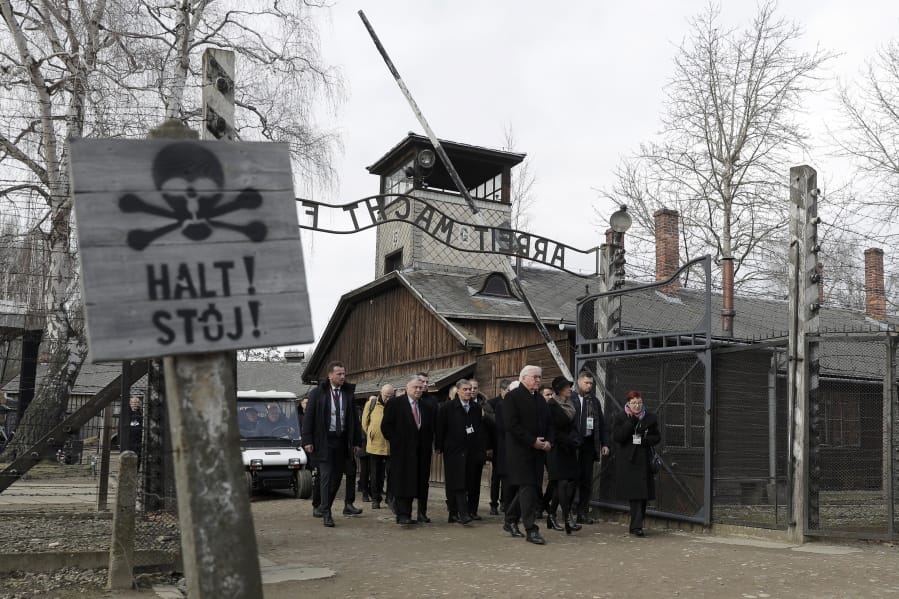 Germany&#039;s President Frank-Walter Steinmeier, center, and his wife Elke Buedenbender enter the Auschwitz I Nazi death camp in Oswiecim, Poland, Monday, Jan. 27, 2020. Heads of State and survivors of the Auschwitz-Birkenau death camp gathered Monday for commemorations marking the 75th anniversary of the Soviet army&#039;s liberation of the camp, using the testimony of survivors to warn about the signs of rising anti-Semitism and hatred in the world today.