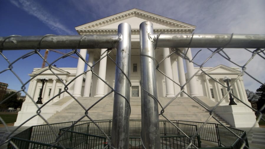The Virginia state Capitol building is surrounded by fencing Thursday in Richmond, Va., in preparation for Monday&#039;s rally by gun rights advocates.
