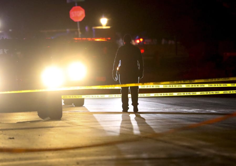 Police investigate after four people were killed and fifth person was injured in a shooting at a Grantsville, Utah, home Friday, Jan. 17, 2020. The suspected shooter was taken into custody by Grantsville police, the Deseret News reported. Grantsville Mayor Brent Marshall said the victims and the shooter are all related, the newspaper reported.