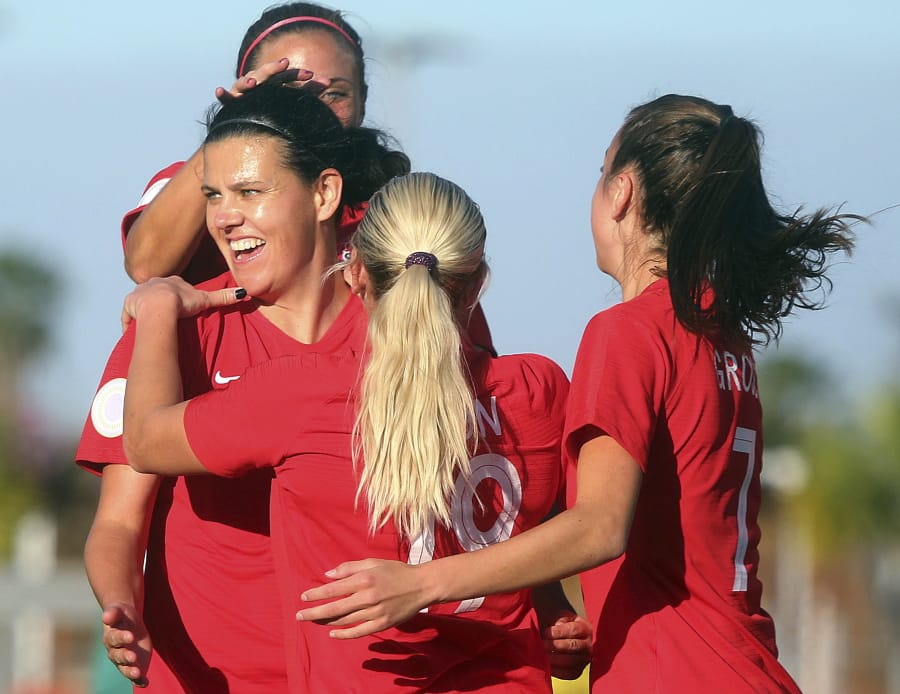 Canada&#039;s Christine Sinclair, front left, celebrates with teammates after scoring against St. Kitts and Nevis during a CONCACAF women&#039;s Olympic qualifying soccer match Wednesday, Jan. 29, 2020, in Edinburg, Texas.