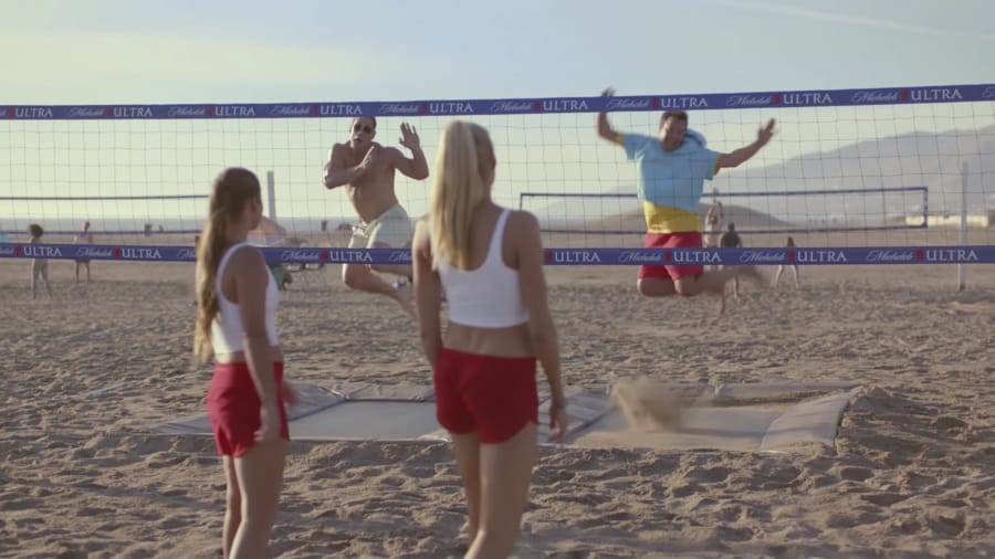 This undated image provided by Michelob ULTRA shows from left, Brooke Sweat, John Cena, Kerri Walsh Jennings and Jimmy Fallon in a scene from the company&#039;s 2020 Super Bowl NFL football spot.  Michelob Ultra stresses its low calories and low carbs in an ad that shows talk show host Jimmy Fallon and wrestler John Cena working out.