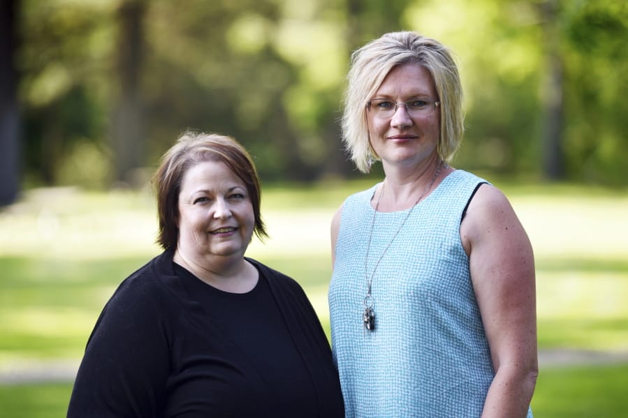 This July 31, 2019 photo shows Stillwater Christian School parents Jeri Anderson and Kendra Espinoza at Woodland Park in Kalispell, Mont.  The Supreme Court will hear arguments Wednesday, Jan. 22, 2020 in a dispute over a Montana scholarship program for private K-12 education that also makes donors eligible for up to $150 in state tax credits. Advocates on both sides say the outcome could be momentous because it could lead to efforts in other states to funnel taxpayer money to religious schools.