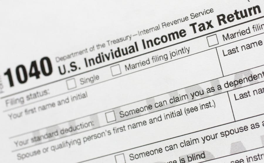 A portion of the 1040 U.S. Individual Income Tax Return form. The IRS began accepting and processing tax returns for individuals on Monday.