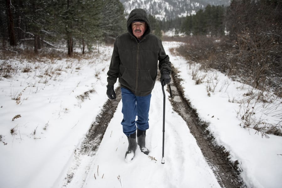 Richard King, 70, walks down a muddy road on the family ranch in December near Zortman, Mont. &quot;It&#039;s called complete serenity.&quot; King said of living on the ranch.