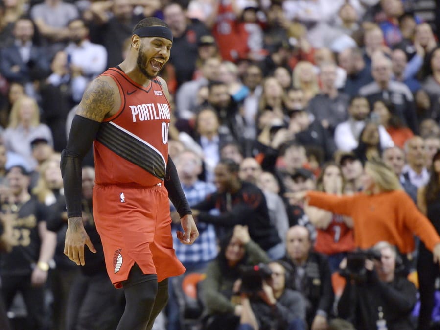 Portland Trail Blazers forward Carmelo Anthony (00) reacts after sinking a go-ahead basket against the Toronto Raptors during the second half of an NBA basketball game Tuesday, Jan. 7, 2020, in Toronto.