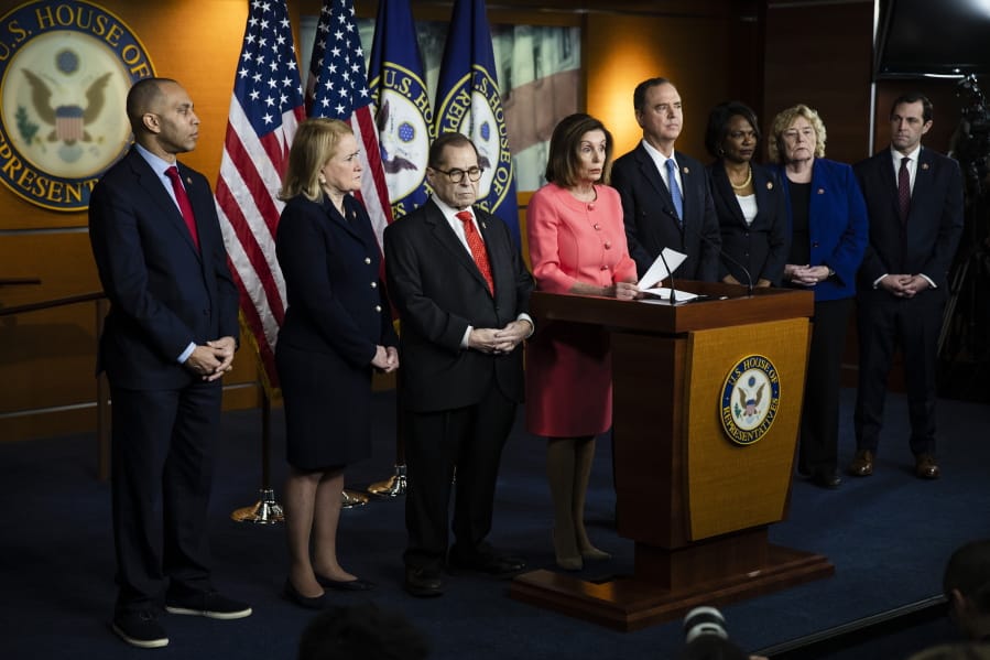 House Speaker Nancy Pelosi of Calif., speaks during a news conference to announce impeachment managers on Capitol Hill in Washington, Wednesday, Jan. 15, 2020. With Pelosi from left are Rep. Hakeem Jeffries, D-N.Y., Rep. Sylvia Garcia, D-Texas, House Judiciary Committee Chairman, Rep. Jerrold Nadler, D-N.Y., Pelosi, House Intelligence Committee Chairman Adam Schiff, D-Calif., Rep. Val Demings, D-Fla., Rep. Zoe Lofgren, D-Calif. and Rep. Jason Crow, D-Colo.