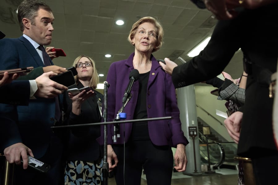 Democratic Presidential candidate Sen. Elizabeth Warren, D-Mass., speaks to the media before attending the impeachment trial of President Donald Trump on charges of abuse of power and obstruction of Congress, Thursday, Jan. 23, 2020, on Capitol Hill in Washington.